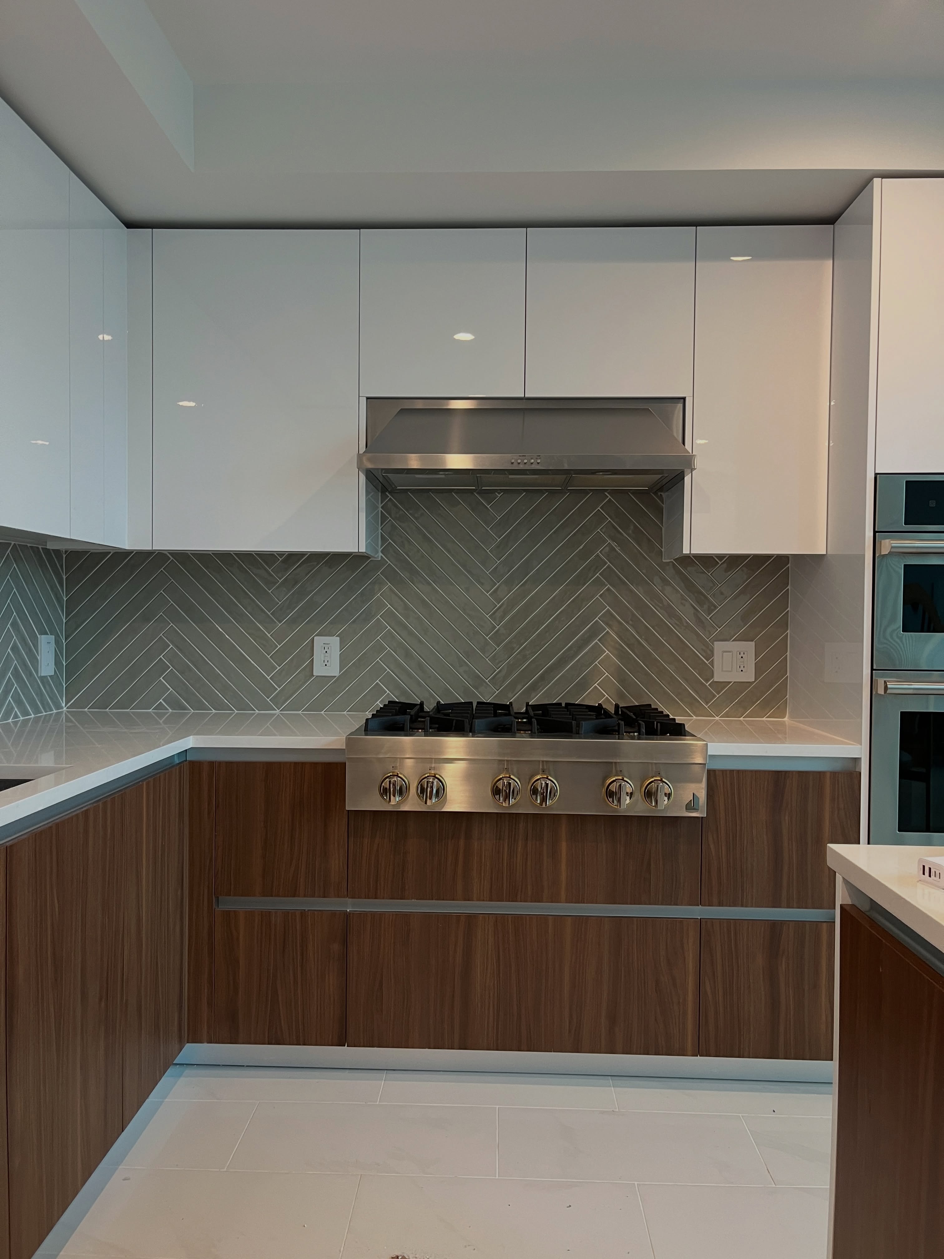 White upper and wood lower kitchen cabinets